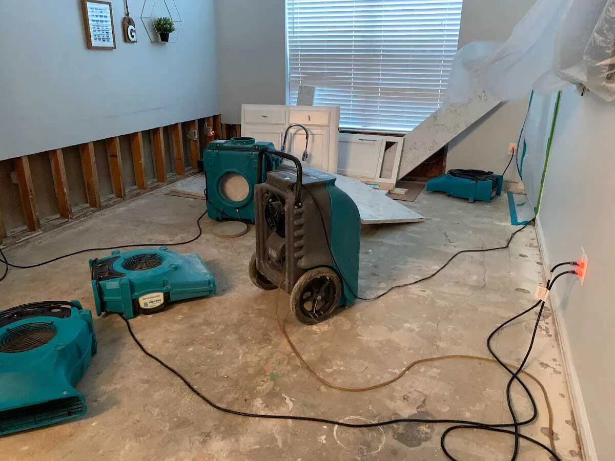 Dehumidifier in flood-cut room for Water Damage Restoration in Suitland